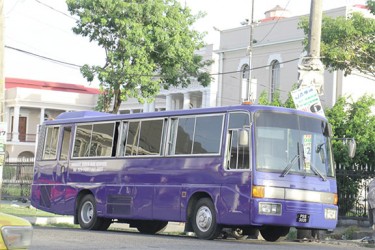 One of the 44-seat buses parked in front of the Public Buildings yesterday. (Photo by Arian Browne) 
