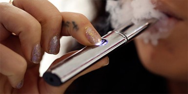 Woman smoking an ecigarette (Huffington Post photo) 