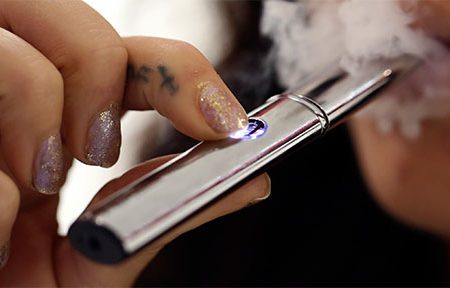 Woman smoking an ecigarette (Huffington Post photo)
