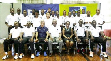 GFF President Christopher Matthias (centre sitting) and CONCACAF Head of Referees Peter Pendergast (third from left sitting) posing for a photo opportunity with participating referees following the conclusion of the FIFA Referees Assistance Program (RAP)