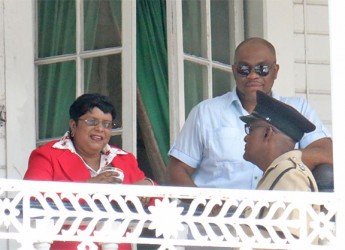 From left, Town Clerk (ag) Carol Sooba talking with Assistant Superintendent Langevine in the presence of her body guard Sean Hinds.