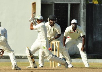 Demerara skipper Vishaul Singh about to smash a ball on his way to his 153 runs top score yesterday at the Guyana Cricket Club Ground, Bourda yesterday.