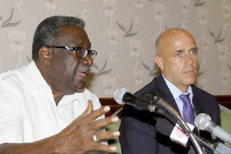 West Indies legend Clive Lloyd speaks as Richard Pybus, WICB Director of Cricket listens, during the signing of the a new Collective Bargaining Agreement and Memorandum of Understanding by WICB and WIPA on Thursday. (Photo courtesy of WICB Media Photo/Randy Brooks.)