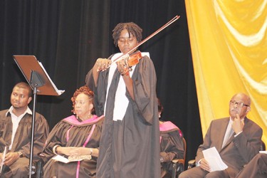 Best Graduating Student of the National School of Music performing Ave Maria on her violin at the National Culture Centre on Thursday. (Photo by Arian Browne)