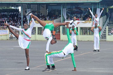 South Ruimveldt Secondary School students performing a physical display routine yesterday during the Education Rally at the National Park. (Arian Browne photo) 