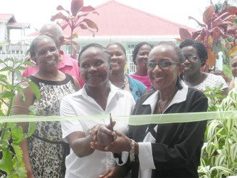  Women’s Refuge was officially launched yesterday when the ceremonial ribbon was cut by its Executive Director Ingrid Goodman (right) and one of the clients, Esther (left)  