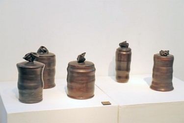 Large jars with lids on display by ceramics artist Sigrid Sandker 
