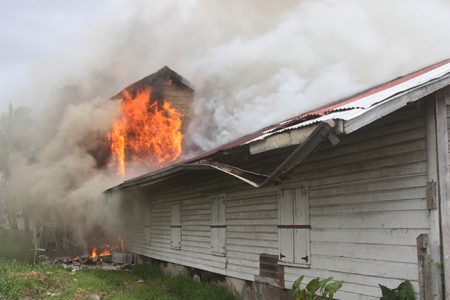 The bond belonging to the Guyana National Newspapers Limited in Lama Avenue on fire
yesterday. (Photo by Arian Browne) 