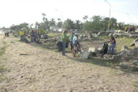  Volunteers cleaning the coastline during yesterday’s International Coastal Clean-Up Day observance (Natural Resources Ministry photo)
