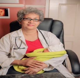 Dr Madhu Singh cradles Guyana’s first IVF baby 