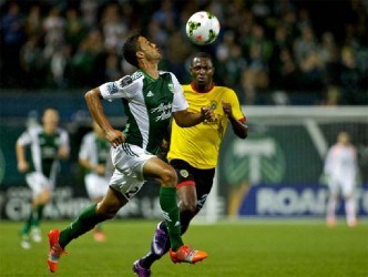 Alpha United’s Caio Oliviera (right) challenges Portland Timbers Taylor Peay for possession of the ball during their side’s CONCACAF Champions’ League group fixture Tuesday night. 