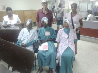 From left (sitting) Jaspattie Dwarka, LeBert Jordon and Chandrawattie Harbarran. Standing in back are (from left) Kunti Bacchus, Nurse-in-Charge of the Eye Clinic and relatives of the patients. (Suraj Narine Photo) 