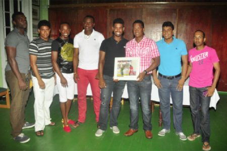 West Indies batsman Leon Johnson, who recently became the 300th cricketer to play for the West Indies in the 500th test match played by the regional side,  was last night honoured by the Georgetown Cricket Club (GCC) following his debut against Bangladesh in the second test  in Gros Islet, St Lucia September 13-17.
Johnson, who at 16 made his first class debut for Guyana, has played club cricket for GCC.
Above Johnson, third from right, shares the moment with some of his contemporaries from left, Joshua Wade, Elon Fernandes, Trevon Griffith, Christopher Barnwell, Robin Bacchus, Delon Fernandes and Vishal Singh. See details in tomorrow’s issue.
(Orlando Charles photo)
