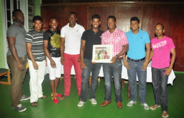 West Indies batsman Leon Johnson, who recently became the 300th cricketer to play for the West Indies in the 500th test match played by the regional side,  was last night honoured by the Georgetown Cricket Club (GCC) following his debut against Bangladesh in the second test  in Gros Islet, St Lucia September 13-17. Johnson, who at 16 made his first class debut for Guyana, has played club cricket for GCC. Above Johnson, third from right, shares the moment with some of his contemporaries from left, Joshua Wade, Elon Fernandes, Trevon Griffith, Christopher Barnwell, Robin Bacchus, Delon Fernandes and Vishal Singh. See details in tomorrow’s issue. (Orlando Charles photo) 