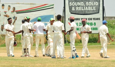 The victorious Demerara side show sportsmanship after their comprehensive win. 