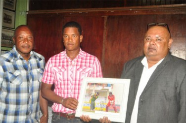 New West Indies test player Leon Johnson flanked by Monty Lynch, left and GCC president Lionel Jaikarn at the reception held in his honour Friday evening at the Georgetown Cricket Club pavilion. (Orlando Charles photo) 