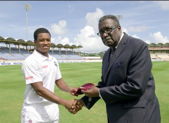 FLASHBACK! Leon Johnson receives his test capo from former West Indies and Guyana captain Clive `Supercat’ Lloyd. (Photo courtesy of WICB media) 