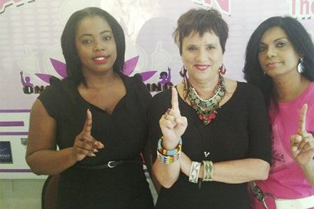 Creator of The Vagina Monologues Eve Ensler is flanked by CADVA representatives Dianne Madray (right) and Tracey Khan-Drakes.