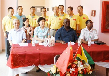 Sitting from left: Ambassador of the Republic of China to Guyana Zhang Limin, the female Chinese interpreter, Minister of National Health & Family Planning Commission, the Peoples Republic of China Li Bin, Chairman of the LHC Board of Management Mortimer Mingo, and Chief Medical Officer Dr Shamdeo Persaud. Standing are Chinese medical practitioners attached to the Georgetown Public Hospital.