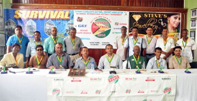 Minister of Culture, Youth and Sports Dr. Frank Anthony (center) is surrounded by executives and members of the GFSCA yesterday at the 4th annual launching of the Guyana Softball Cup.