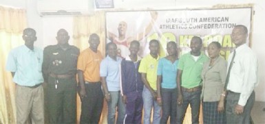 President of the AAG, Aubrey Hutson (extreme right) and members of the association’s executives pose for a photo opportunity with some of the athletes that will compete in the South American 10km Road Classic. 