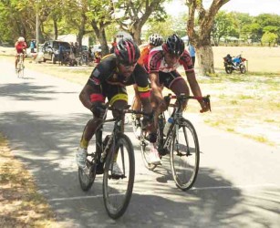 Robin Persaud crossing the finish line ahead of Chris Holder and Paul Choo-Wee-Nam. (Orlando Charles photo)