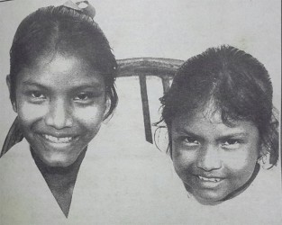 Survivors: Bertina and Bernadette in May 1995 after their arduous month-long trek through the jungle. 