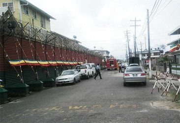 Fire fighters and policemen outside the Camp Street prison minutes after arriving to deal with the report. 