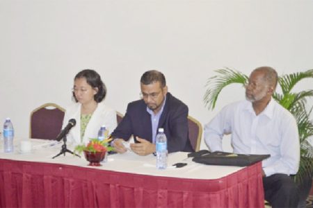 Minister of Natural Resources and the Environment, Robert Persaud (centre) flanked by UNDP Deputy Resident Representative, Chisa Mikami (left) and representative from the Guyana Gold and Diamond Miners Association, William Woolford. (GINA photo)
