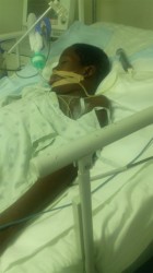 An unconscious Jameel Mounter at the Georgetown Public Hospital’s Intensive Care Unit on Tuesday.