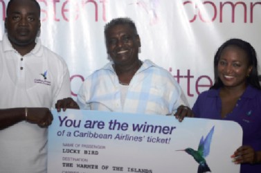  From left: Kevin Daniels (Airport Customer Service Agent) and winner of ticket from Guyana to Toronto, Khemwant Persaud with Adaceia Figueira (Cargo Coordinator).