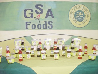 A line of products available from the Guyana School of Agriculture (GSA) including mango achar, hot sauce, and porridge mix 