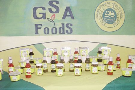 A line of products available from the Guyana School of Agriculture (GSA) including mango achar, hot sauce, and porridge mix
