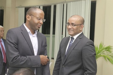 Digicel’s CEO Gregory Dean and former president Bharrat Jagdeo chat at the GMSA dinner.  