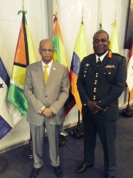 Minister of Home Affairs, Clement Rohee (left) and GDF Chief of Staff, Brigadier Mark Phillips at the meeting in Peru. (Ministry of Home Affairs photo) 