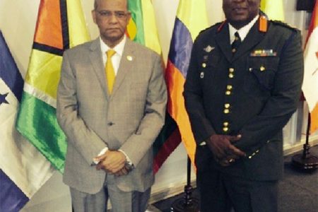 Minister of Home Affairs, Clement Rohee (left) and GDF Chief of Staff, Brigadier Mark Phillips at the meeting in Peru. (Ministry of Home Affairs photo)
