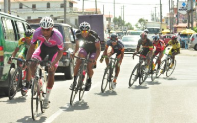 Cycling action during yesterday’s third stage on the roads of West Demerara (Orlando Charles photo)  