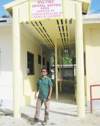 Sharir Chan in front of the waiting area at the Mahaicony Hospital