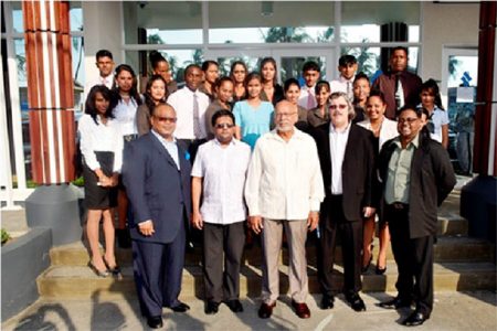 President Donald Ramotar (centre in front row), Finance Minister Dr. Ashni Singh (second from left), Member of the Board of Director, Derwin Howell (left), Managing Director, Republic Bank Limited John Alves (second from right), Branch Manager Imran Sacoor and other staffers of the new facility.  (GINA photo)