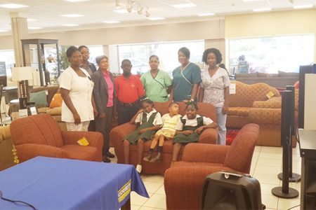 Candace Kewley (far right), the Head Nurse at the Ptolemy Reid Rehabilitation Centre, along with other staff members, patients and Guyana’s Public Relations and Promotions Officer Roberta Ferguson with the new suite donated by Courts. 
