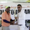 Winner of the Sanjay’s Jewelry Classic Mahendra Bhagwandin receives his trophy from owner of Sanjay’s Jewelry Sanjay Persaud.