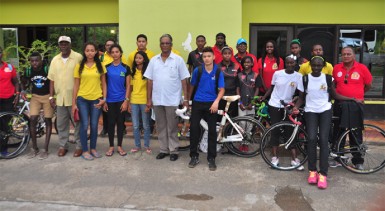 Director of Sport Neil Kumar along with Guyana’s delegation of athletes and officials pose for a photo after arriving at the Stardust Hotel here in Paramaribo, Suriname. (Orlando Charles photo)