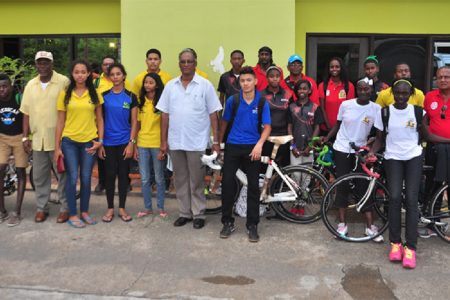Director of Sport Neil Kumar along with Guyana’s delegation of athletes and officials pose for a photo after arriving at the Stardust Hotel here in Paramaribo, Suriname. (Orlando Charles photo)