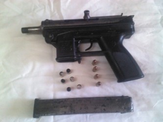 The firearm and matching rounds which were recovered by the police yesterday at Waterloo Street, Georgetown.