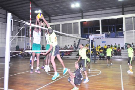  Joshua Jagmohan (11) goes up for a spike during the third set of Guyana’s straight set win versus French Guiana last night at the Ismay van Wilgen Sporthal. (Orlando Charles photo)