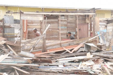 Residents dismantling their homes at Tiger Bay.  