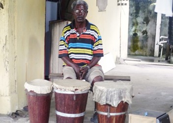 Richard Waddle with the drums he made 