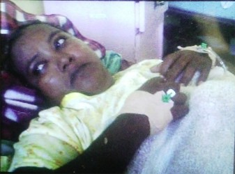 An injured Savitri Harricharan at the Georgetown Public Hospital, after surgery.