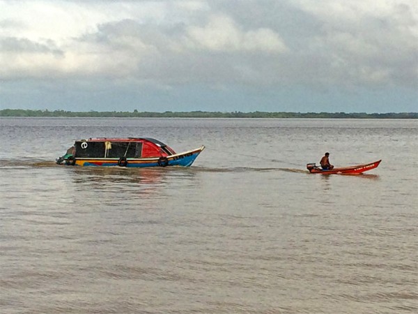 The little boat that could: This boat was seen towing this passenger boat in the Essequibo River (Peter Hugh photo)