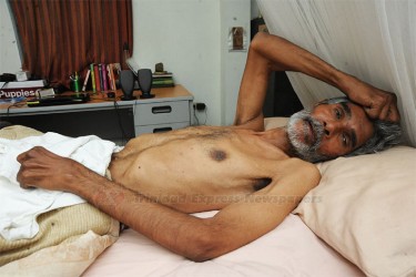Dr. Wayne Kublalsingh bedridden at home (Trinidad Express photo) 